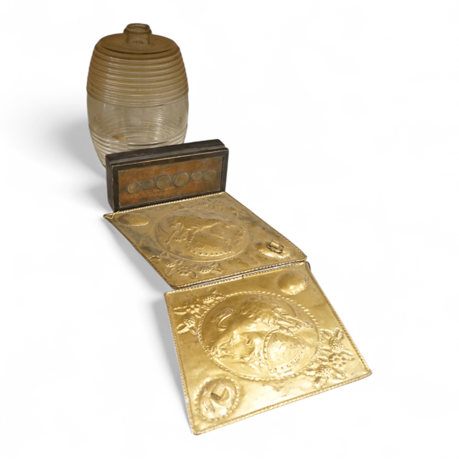A Victorian glass spirit barrel, converted to a lamp base, together with a pair of embossed sheet-brass heraldic plaques and a replica coin set box
